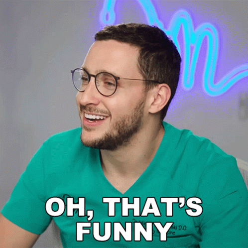 Man With Glasses And Hat At Computer In Restaurant GIF