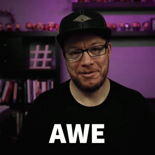 Man With Glasses And Hat Saying Awe GIF