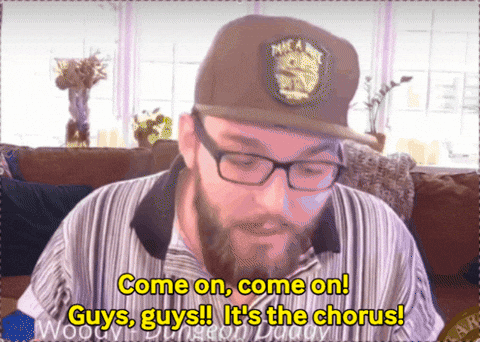 Man With Glasses and Hat Saying Come On Guys It's The Chorus