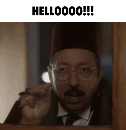 Man With Glasses and Hat Saying Hellooooo