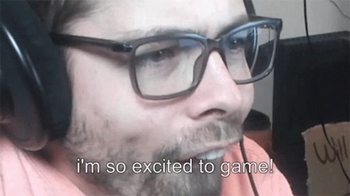 Man With Glasses and Headphones Excited to Play Game