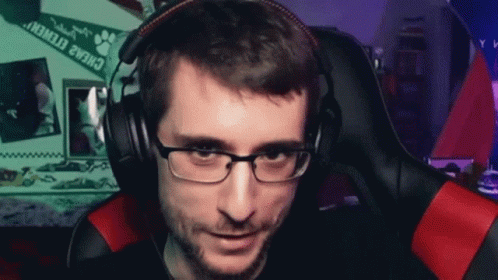 Man With Glasses And Headphones In Gaming Chair GIF