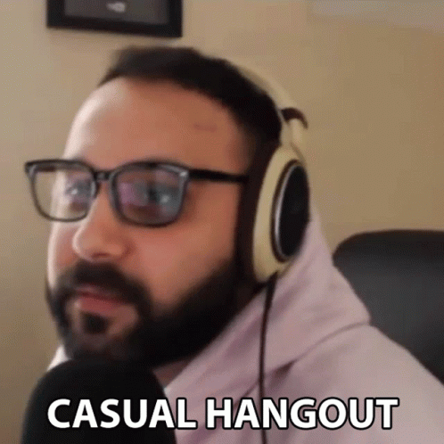 Man With Glasses And Headphones In Pink Hoodie Says Casual Hangout GIF