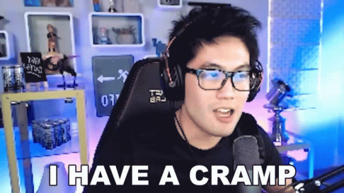 Man With Glasses and Headphones Says I Have a Cramp