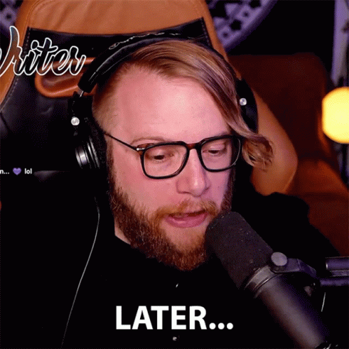 Man With Glasses and Headphones Says Later