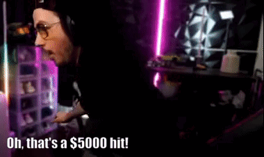 Man With Glasses and Headphones Says Oh That's a $5000 Hit