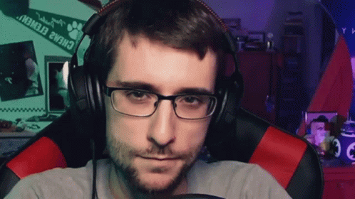 Man With Glasses And Headphones Sitting Near Paw Print GIF