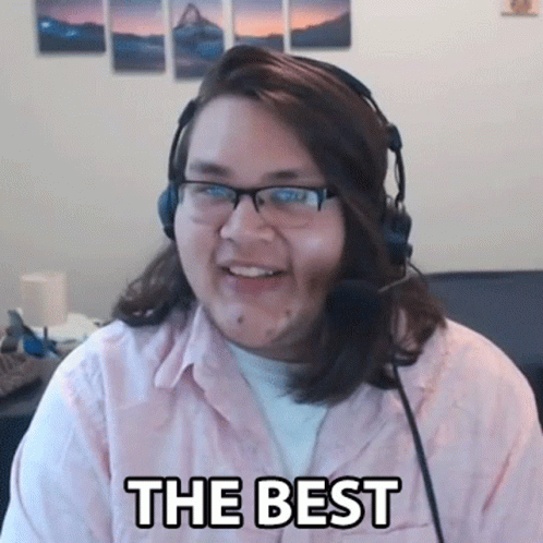 Man With Glasses and Headphones Smiling Saying The Best