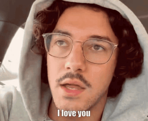 Man with Glasses and Hoodie Saying I Love You