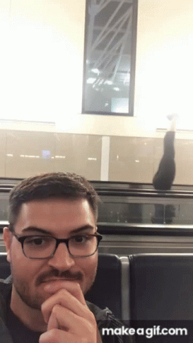 Man With Glasses and Mustache at Airport Make a Gif.com