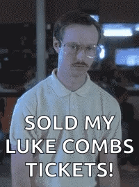 Man With Glasses And Mustache Holding Sign Sold My Luke Combs Tickets GIF
