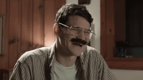 Man with Glasses and Mustache Laughing