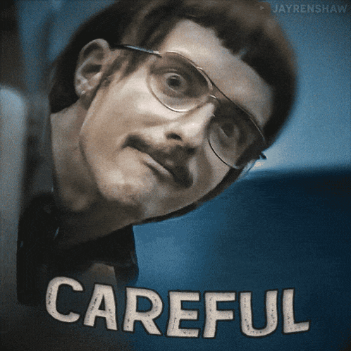 Man With Glasses And Mustache Saying Careful GIF