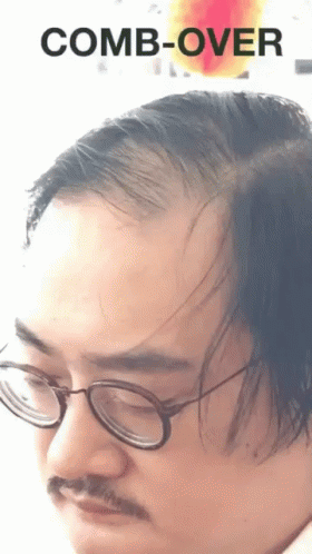 Man with Glasses and Mustache Saying Comb-Over