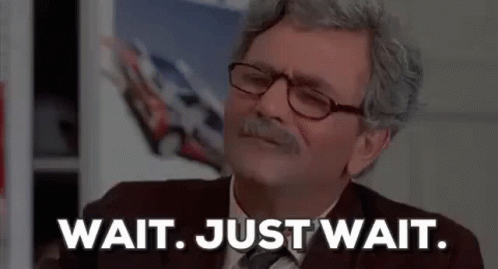 Man With Glasses and Mustache Says Wait Just Wait
