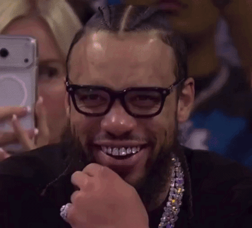 Man With Glasses And Necklace Smiling Selfie GIF