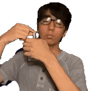 Man With Glasses and Nose Ring Holding Glass