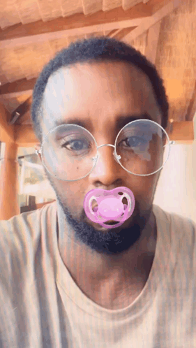Man With Glasses And Pink Pacifier GIF
