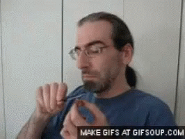 Man with Glasses and Ponytail Eating Food