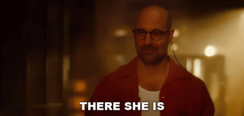 Man with Glasses and Red Shirt Saying There She Is