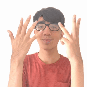 Man with Glasses and Red Shirt Showing Fingers
