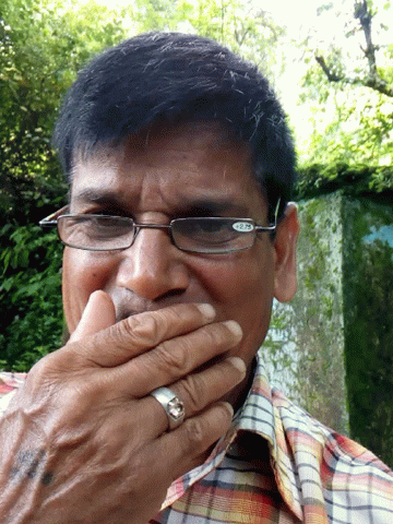 Man With Glasses And Ring Holding Hand To Mouth GIF