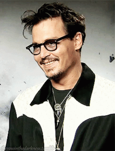 Man with Glasses and Skull Necklace