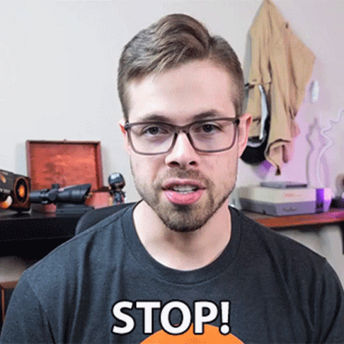 Man With Glasses and Stop Shirt
