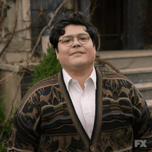 Man With Glasses and Sweater Saying FX
