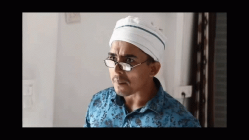 Man With Glasses and White Hat Looking Left