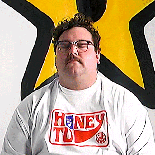 Man with Glasses and White Shirt Saying Honey To