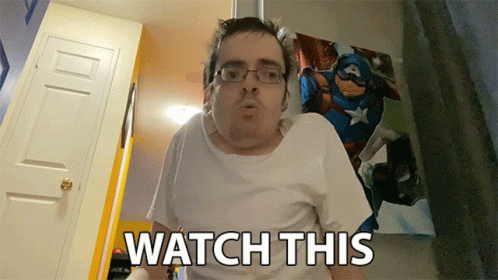 Man With Glasses and White Shirt Saying Watch This