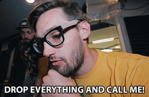 Man With Glasses And Yellow Shirt Saying Drop Everything And Call Me GIF