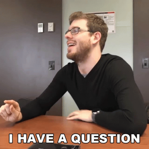 Man with Glasses Asking Question
