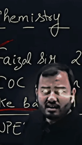 Man With Glasses at Chemistry Blackboard