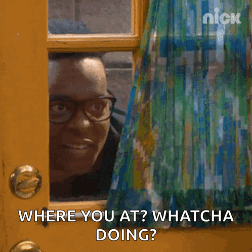 Man With Glasses at Window Saying Where You At
