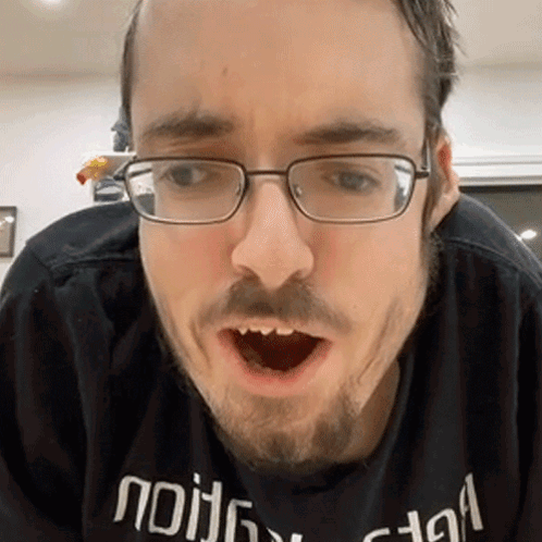 Man With Glasses Beard In Black Shirt Saying Nothing GIF