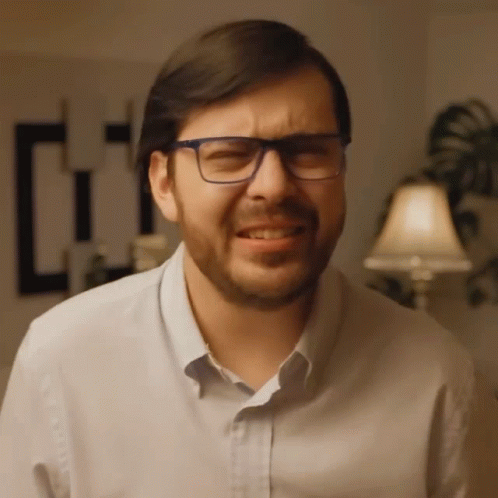 Man With Glasses Beard Making Face