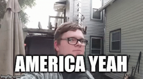 Man With Glasses Before House America Yeah