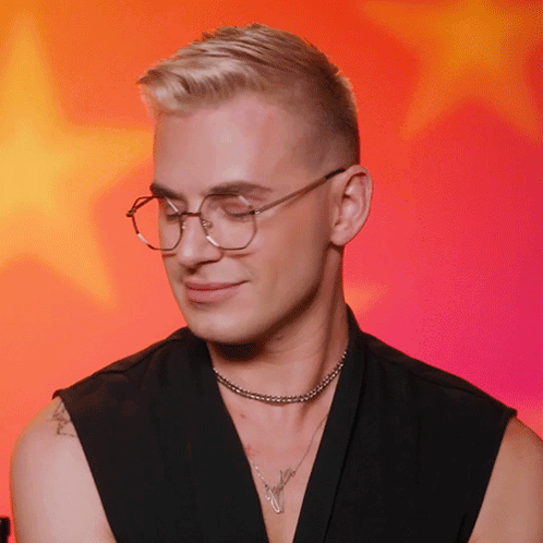 Man With Glasses, Choker, and Arm Tattoo