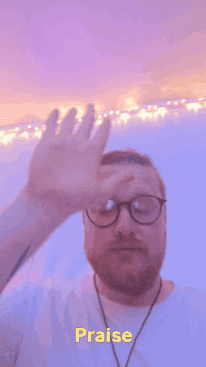 Man With Glasses Covering Face Saying Praise GIF