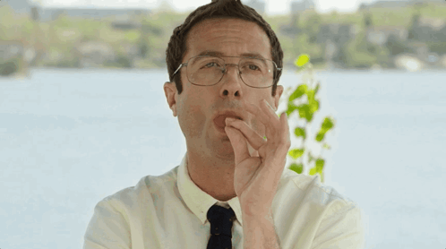 Man With Glasses Covering Mouth GIF