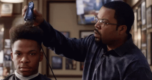Man With Glasses Cutting Hair