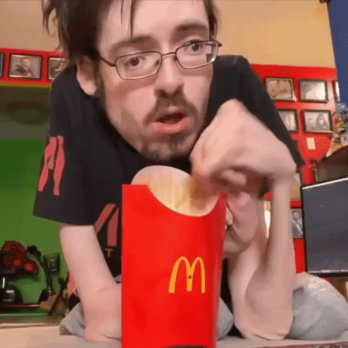 Man With Glasses Eating McDonald's Fries GIF