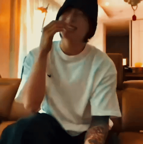 Man With Glasses Eating On Couch GIF