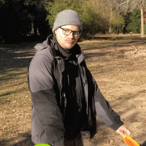 Man With Glasses Enjoying Two Frisbee GIF