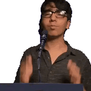 Man With Glasses Hands Up at Microphone