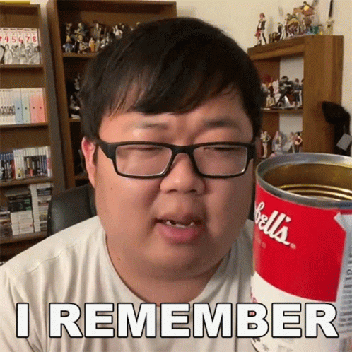 Man With Glasses Holding Can of Bell's Soup