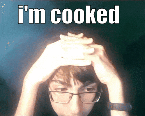 Man With Glasses Holding Head Saying I'm Cooked