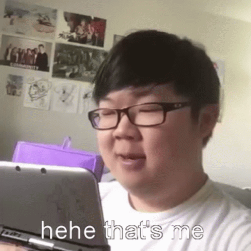 Man With Glasses Holding Nintendo 3DS Making Funny Face
